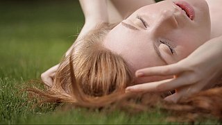 Very cute redhead teen spreading in nature